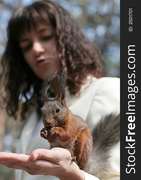 Women with squirrel on hand