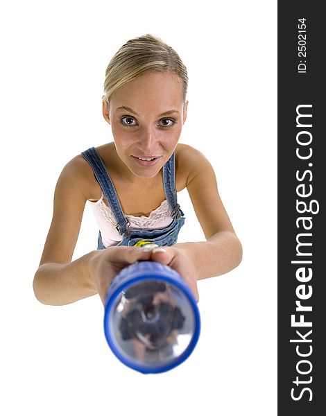 Young smiling blonde wearing dungarees with flash light in hands. Isolated on white in studio. Looking at camera. Whole body, headshot. Young smiling blonde wearing dungarees with flash light in hands. Isolated on white in studio. Looking at camera. Whole body, headshot