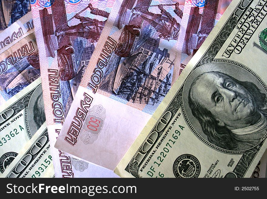 US Dollars and russian roubles banknotes