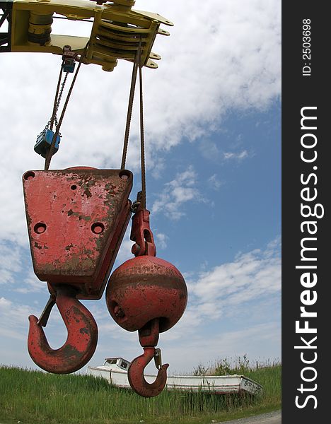 Large crane with two hooks suspended from chain. Large crane with two hooks suspended from chain