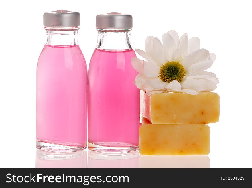 Spa bottles, daisy, soap bars isolated on white. Spa bottles, daisy, soap bars isolated on white