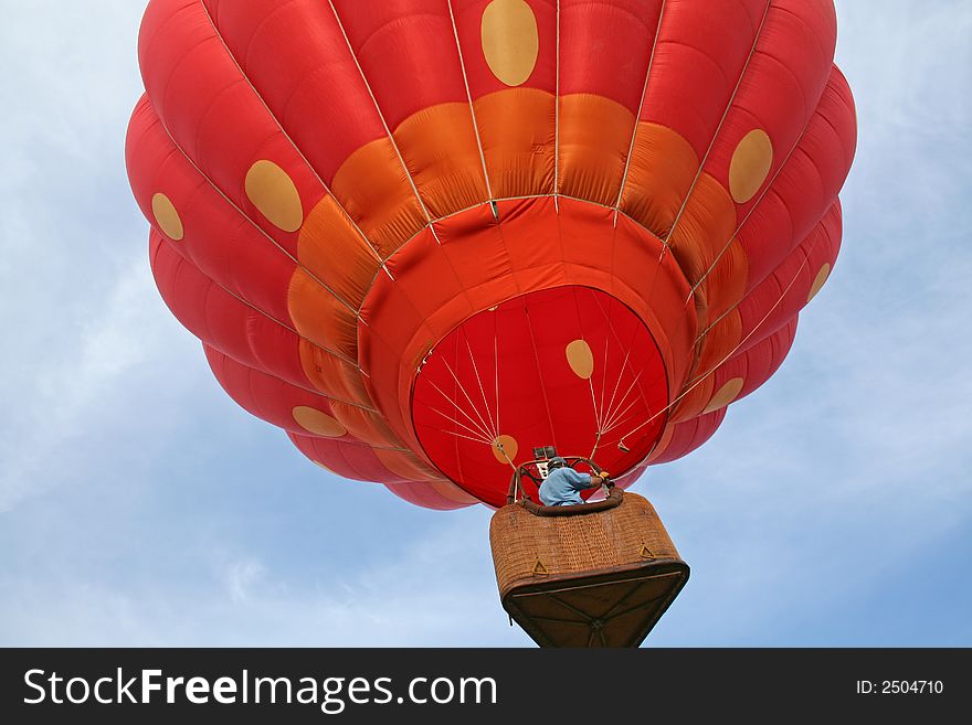 Looking up as strawberry hot air balloon ascends. Looking up as strawberry hot air balloon ascends