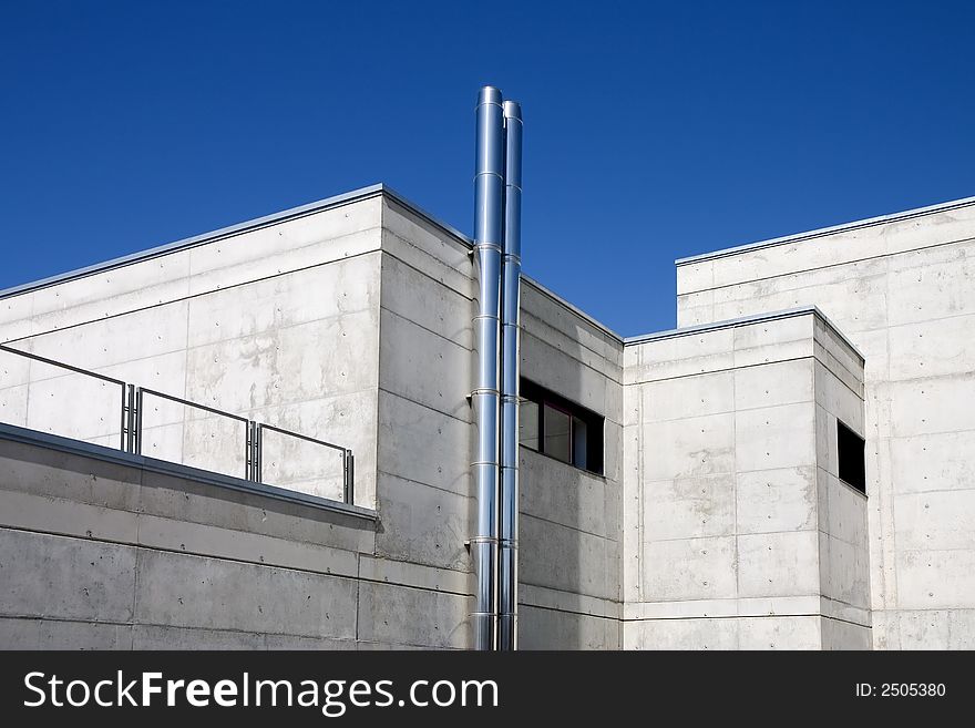 Modern public building against a blue sky