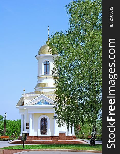 Small church on blue sky background