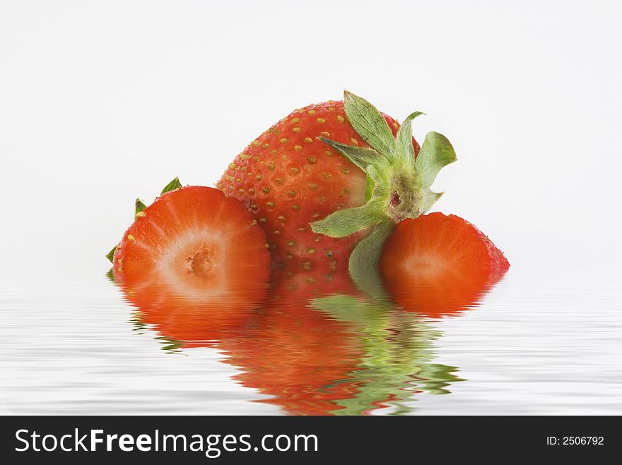Strawberry isolated white background with reflection in the water. Strawberry isolated white background with reflection in the water