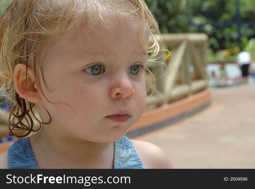 Happy baby girl. in swimming pool