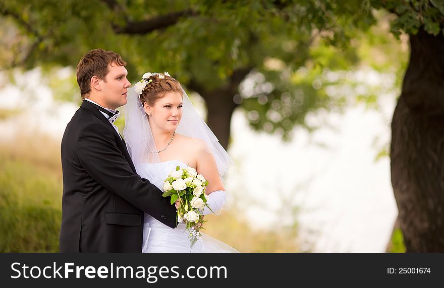 Romantic wedding couple having fun together outdoor in nature