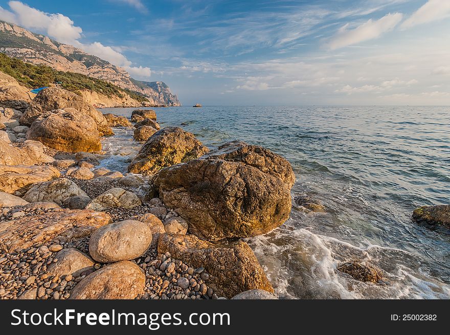 Rocky coastline, sea background