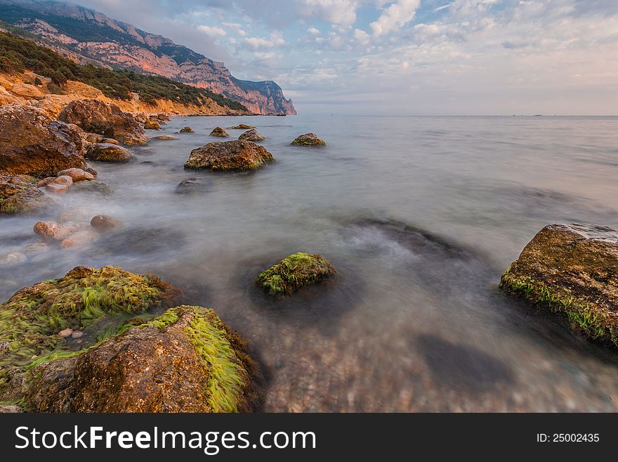 Rocky coastline with pine trees on blue sky and sea background (Inzhir reserve, Crimea, Ukraine). Rocky coastline with pine trees on blue sky and sea background (Inzhir reserve, Crimea, Ukraine)