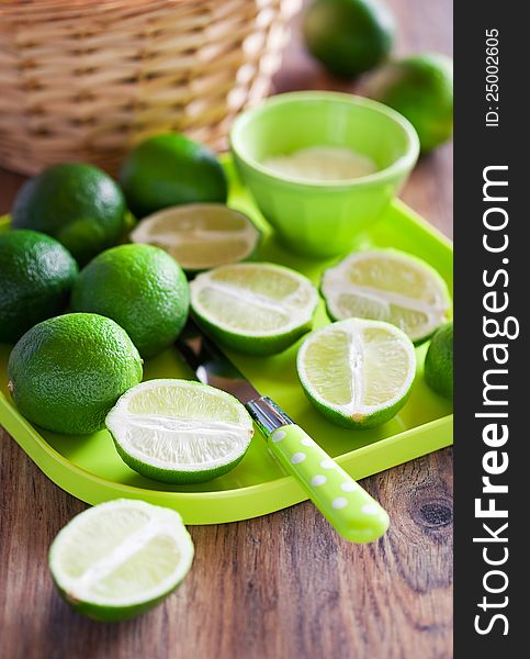 Fresh limes on plate, selective focus