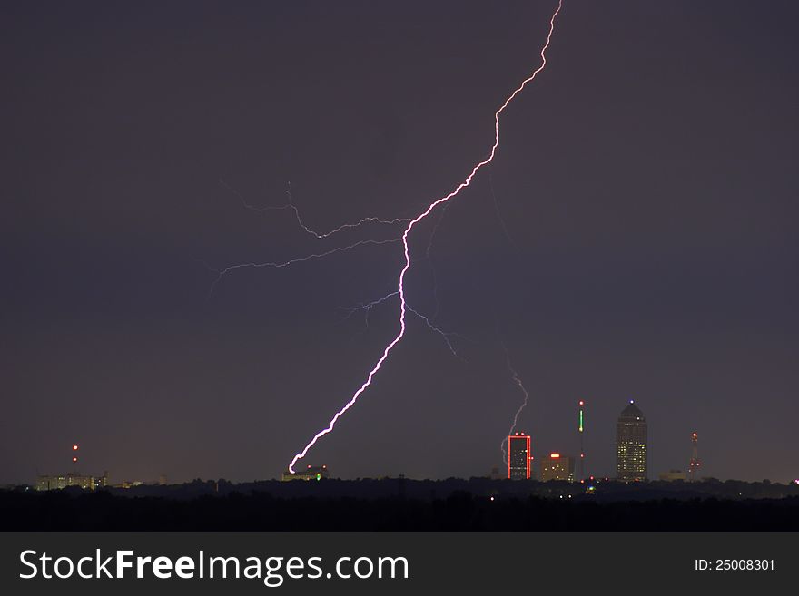Lightning striking within a city. Lightning striking within a city