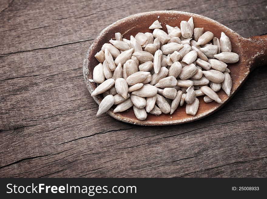 Close up of Sunflower seeds in wooden spoon