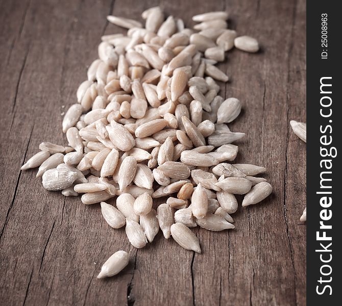 Close up of Sunflower seeds on wooden plank