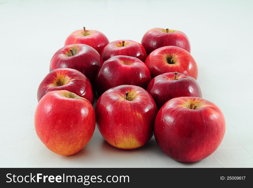 Fresh red apples on white