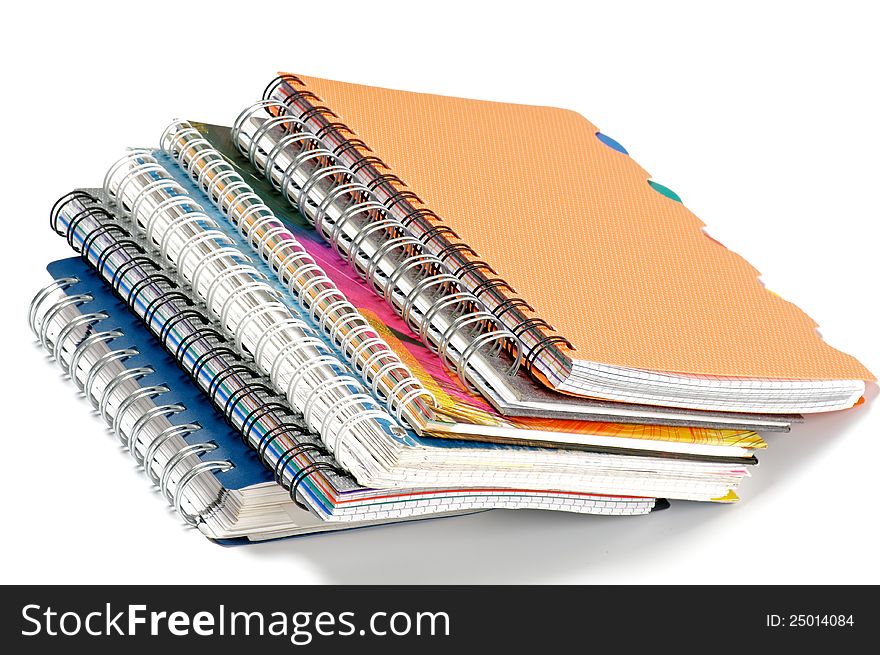 Stack of Color Spiral notepads isolated on white background