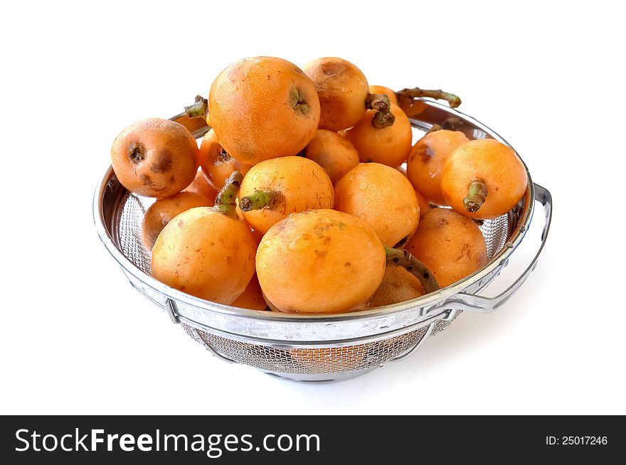 Eskadenia fruits cleaned with water in a strainer