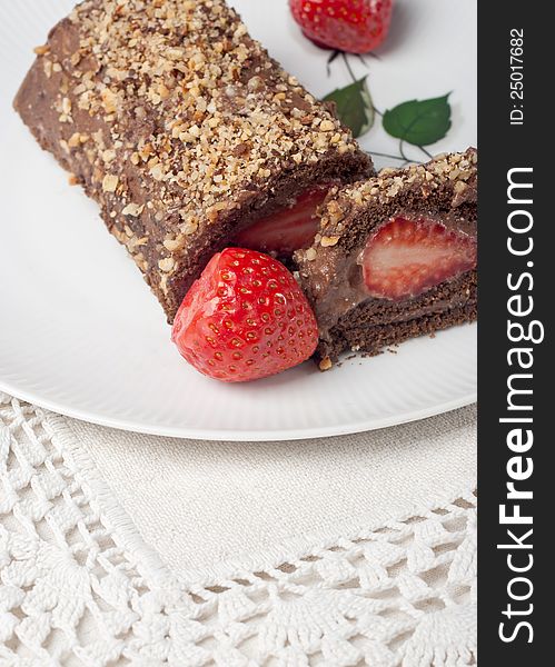 Chocolate swiss roll cake with strawberries. Chocolate swiss roll cake with strawberries