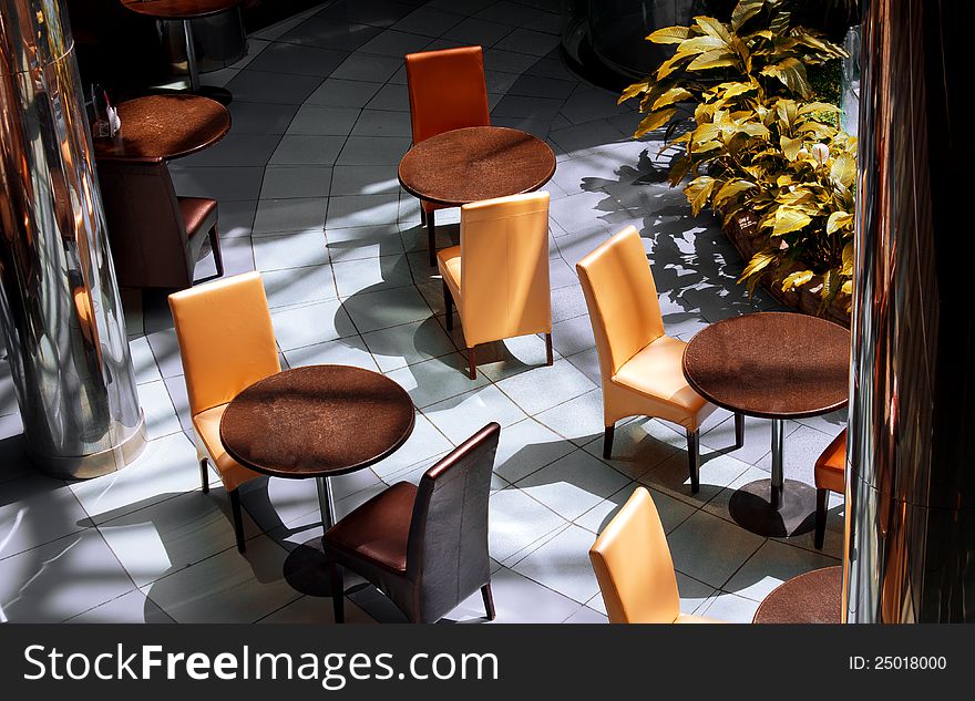 Tables and chairs in a modern cafe. Tables and chairs in a modern cafe