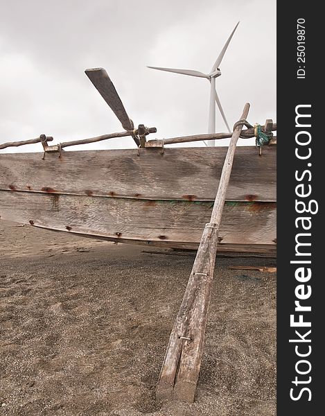 Boat and windmill at the beach