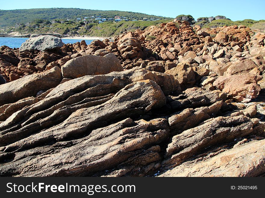 The little holiday settlement at Yallingup on the south west coast of Western Australia has ancient  weathered rocky outcrops and  treeless dune landscape due to the strong  prevailing ocean winds. The little holiday settlement at Yallingup on the south west coast of Western Australia has ancient  weathered rocky outcrops and  treeless dune landscape due to the strong  prevailing ocean winds.