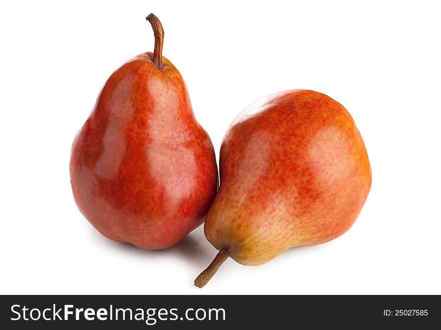 Two ripe juicy pears on a white background. Two ripe juicy pears on a white background