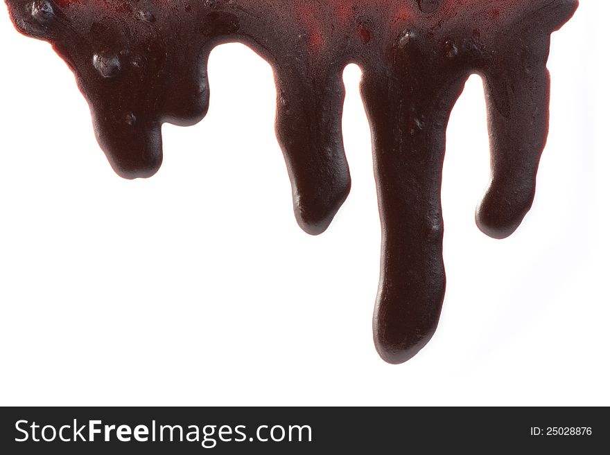 Melted chocolate dripping down a white background. Melted chocolate dripping down a white background.
