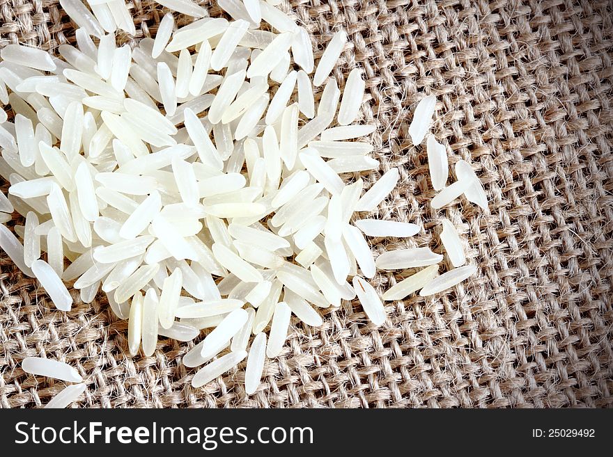 White long white rice on brown sack
