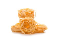 THREE UNCOOKED PASTA NESTS Stock Photography THREE UNCOOKED PASTA NESTS Stock Photography