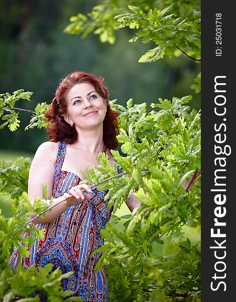 The beautiful woman with oak branches