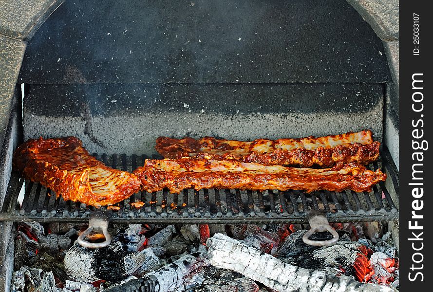 BBQ pork ribs on outdoor grill. BBQ pork ribs on outdoor grill