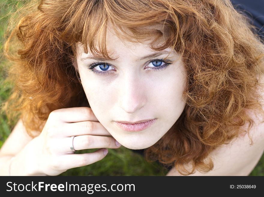 Close up portrait of young pretty woman looking up