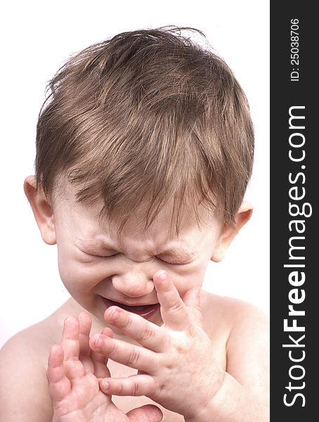 Crying baby boy isolated on white, close up