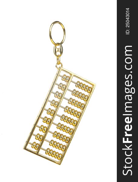 A golden key chain in shape of abacus. A golden key chain in shape of abacus