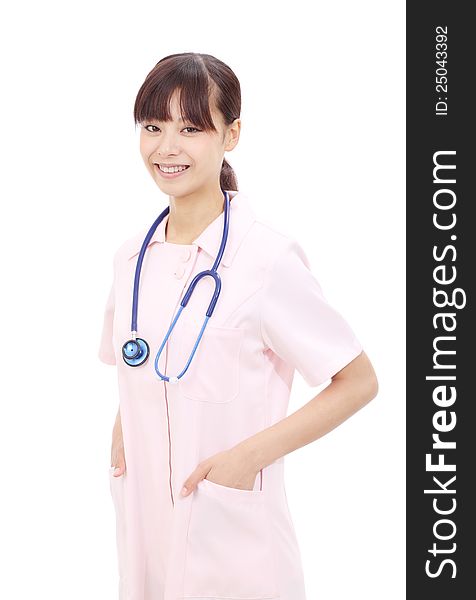 Young asian female nurse with hands in pockets