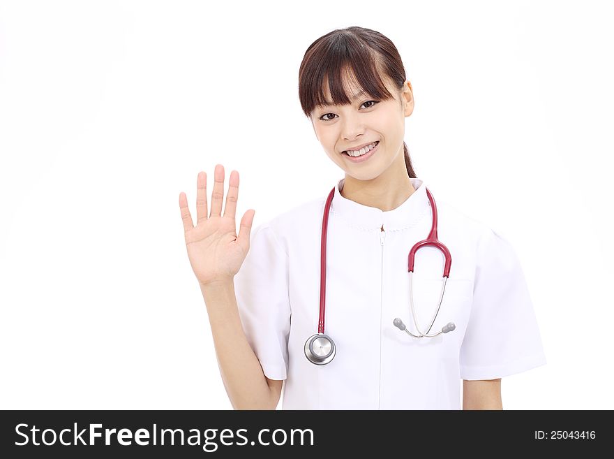 Young asian female nurse with bye bye gesture