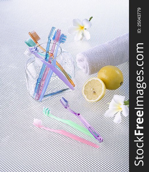 Colorful of toothbrushes in a glass bottle