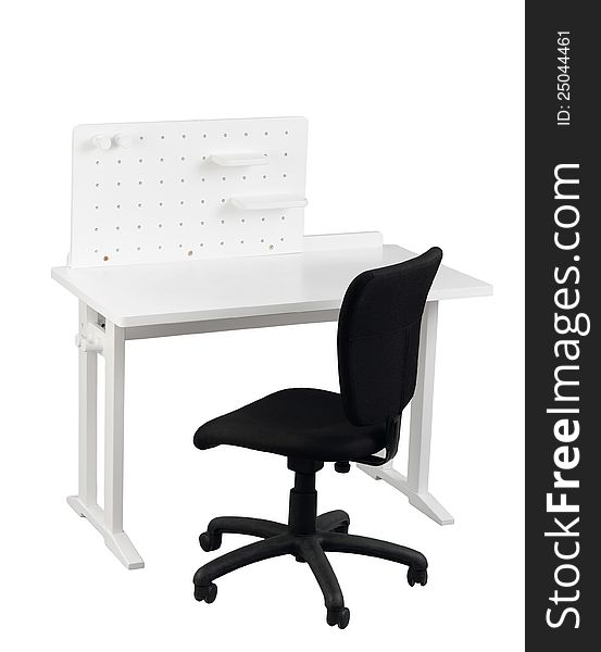 A table with little shelf and black chair for student to do homework or home office. A table with little shelf and black chair for student to do homework or home office