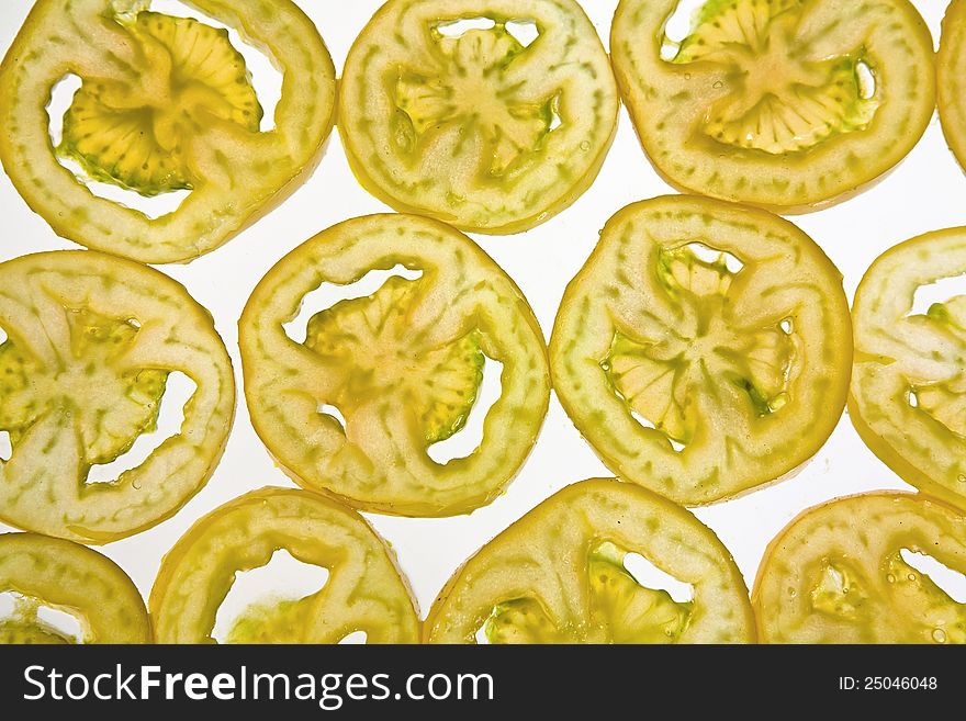 Transparent fruit slices on white background