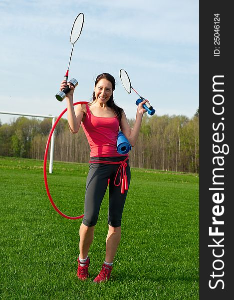 Woman with sport equipments, outdoor sport theme shot