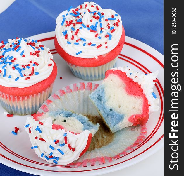 Red white and blue cupcakes on a plate