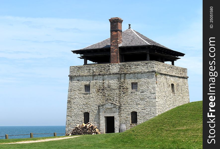 Large stone guard watch tower of an old fort, holding troops with cannons on the top. Large stone guard watch tower of an old fort, holding troops with cannons on the top.