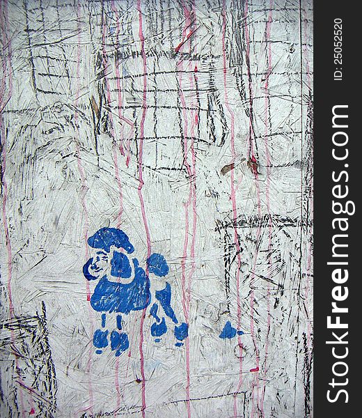 Black and red graffiti showing blue stencilled poodle on gray bakcground. Black and red graffiti showing blue stencilled poodle on gray bakcground