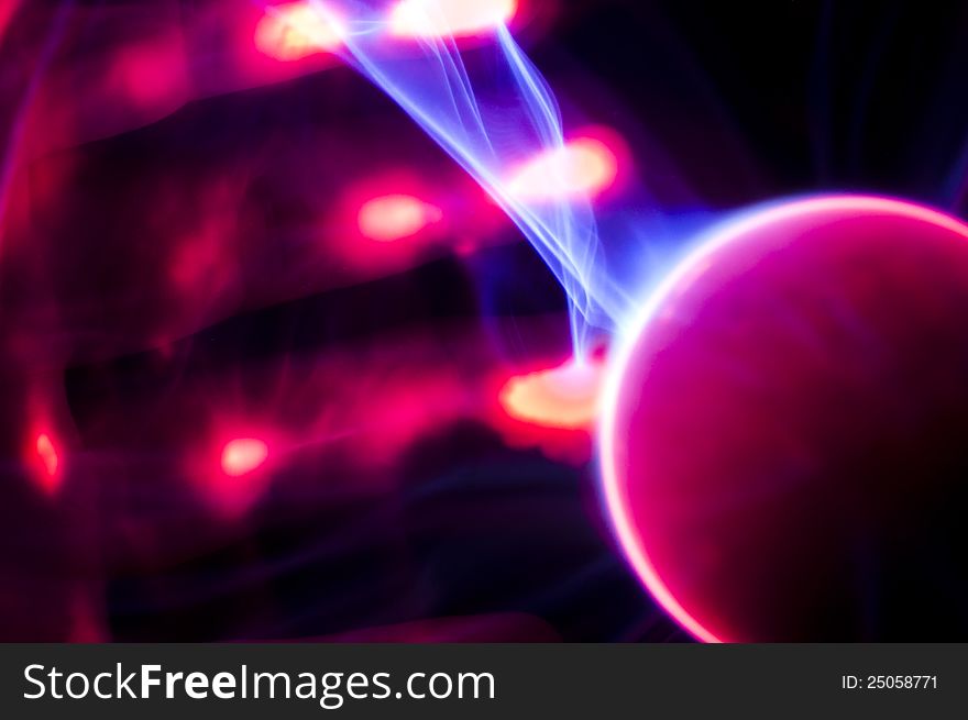 Several fingers glowing as they pull plasma arcs off a sphere. Several fingers glowing as they pull plasma arcs off a sphere.