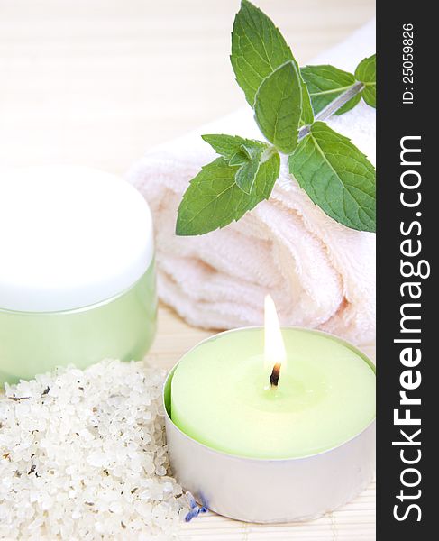 Cosmetic moisturizing cream with mint, herbal sea salt and towel. Cosmetic moisturizing cream with mint, herbal sea salt and towel