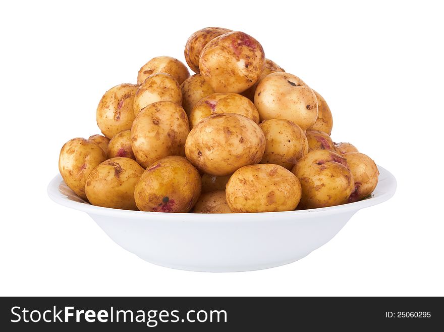 Potatoes in plate isolated on a white background