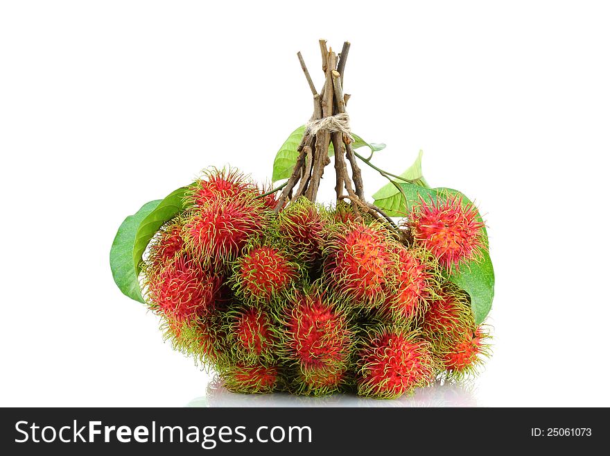Popular Tropical Fruit : A bunch of freshly picked Rambutan,  on white background