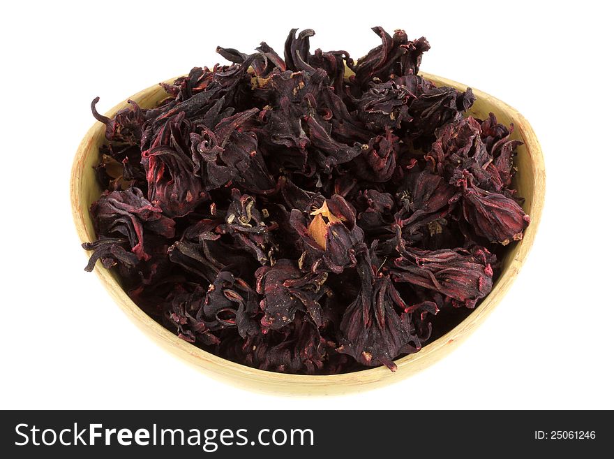 A bowl of dried Roselle Flowers (Hibiscus sabdarrifa) to make herbal tea, isolated on white. A bowl of dried Roselle Flowers (Hibiscus sabdarrifa) to make herbal tea, isolated on white