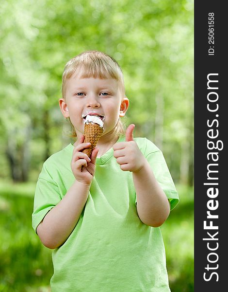 Kid Eating A Tasty Ice-cream Outdoor With Thumb Up