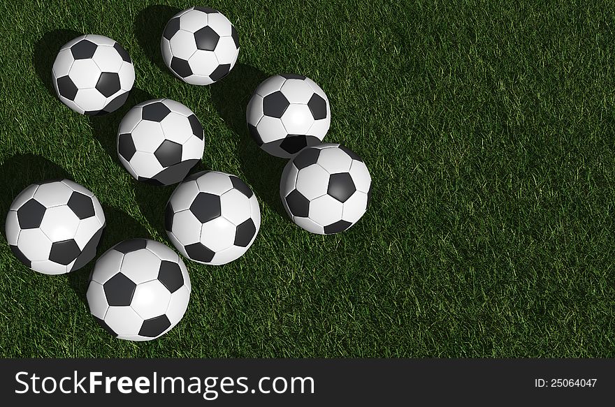 Soccer balls on a green grass