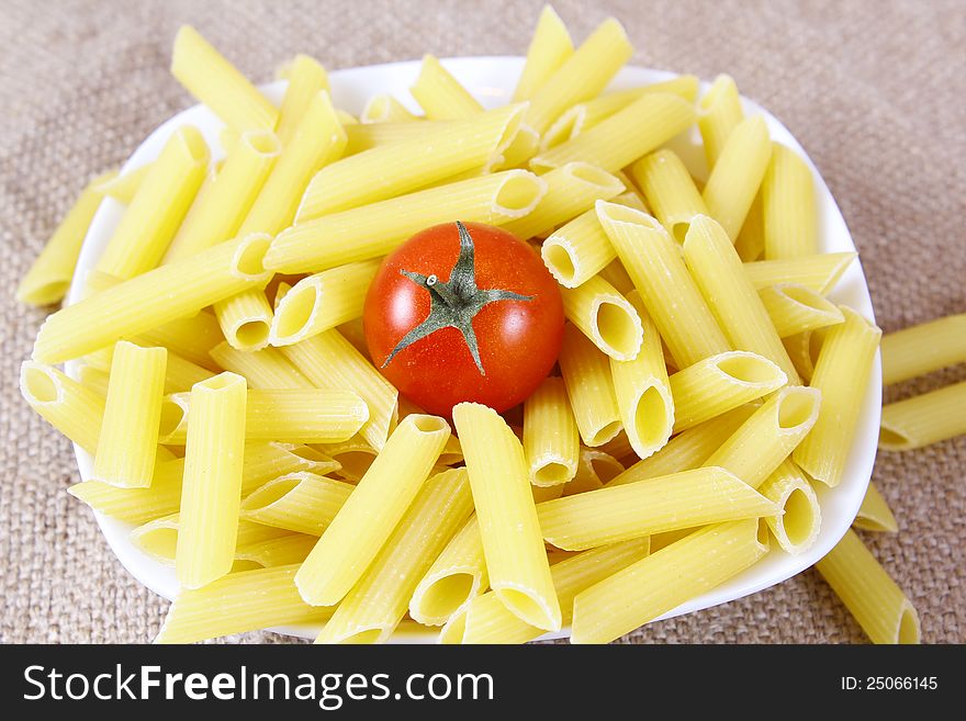 Italian pasta with tomato on a plate